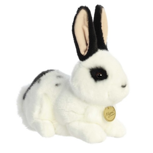 Rabbit! Rabbit! Rabbit! This cute little white bunny Rabbit figurine has  black-tipped ears and shiny black eyes.