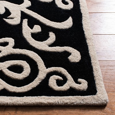 Handmade Black and Ivory Wool Viscose Tufted Area Rug