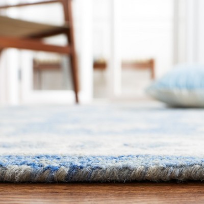 Handmade Blue and Ivory Wool 4'x6' Area Rug