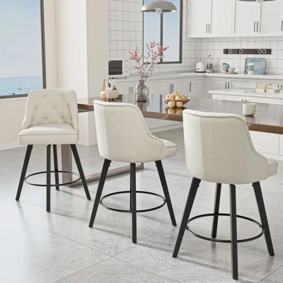 Cream upholstered bar stools around a kitchen island