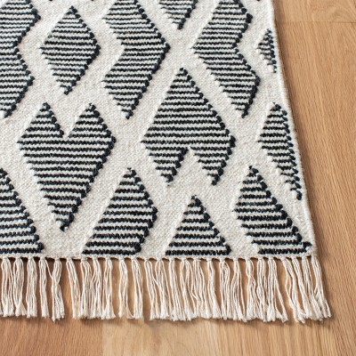 Nomadic Essence Handwoven Black and Cream Wool Area Rug, 5' x 8'