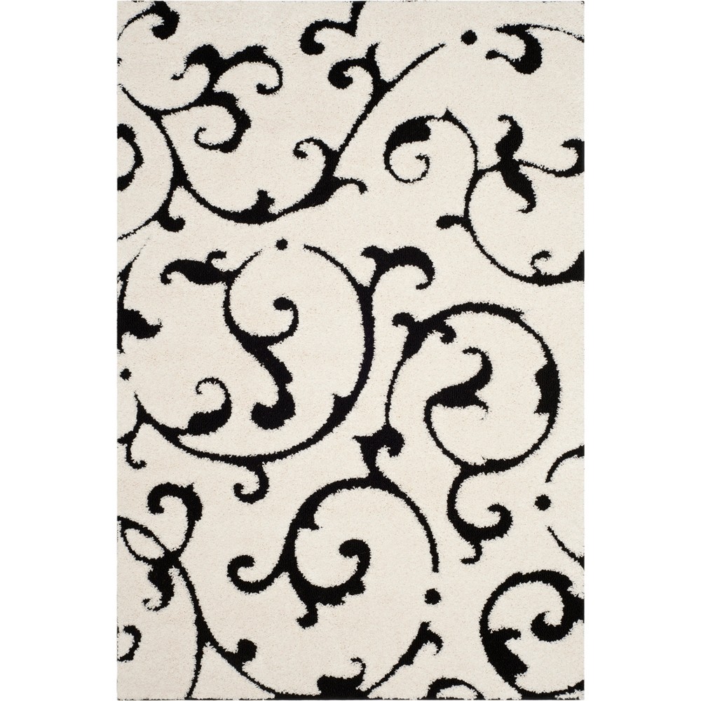 5'3inx7'6in Swirl Loomed Area Rug Ivory/Black - Safavieh