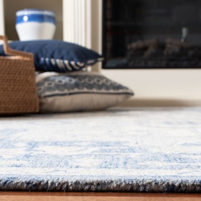 Handmade Blue and Ivory Wool 4' x 6' Tufted Area Rug