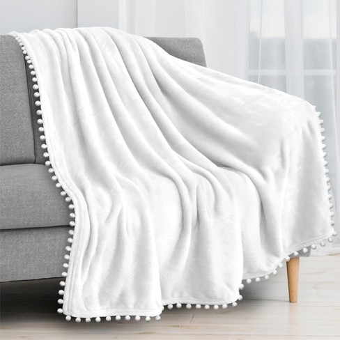 PAVILIA Fleece Pom Pom Blanket Throw for Sofa Bed Soft Lightweight Pompom Fringe Blanket for Couch White Throw 50x60