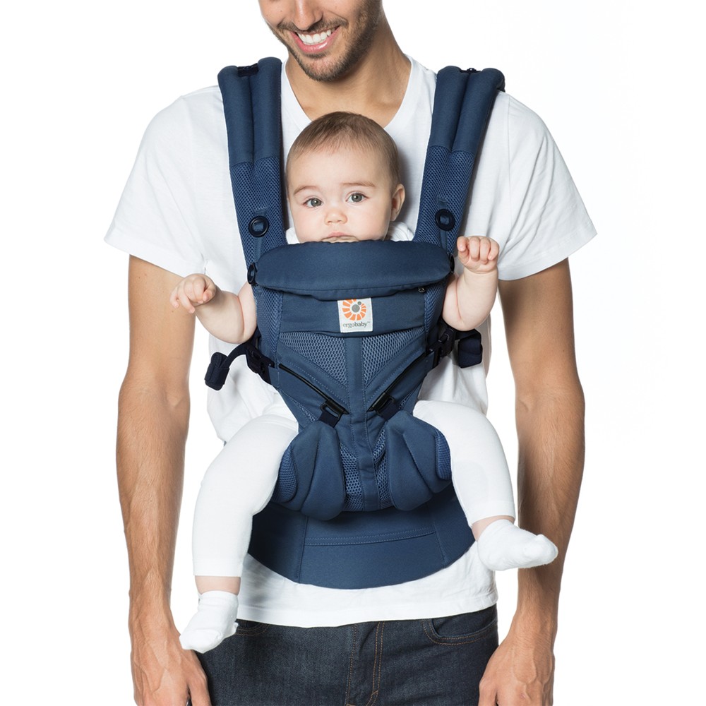 Ergobaby Omni 360 Cool Air Mesh All Position Breatheable Baby Carrier with Lumbar Support- 7-45lb The Ergobaby Omni 360 is the all-in-one, all ages baby carrier that does it all. This versatile carrier provides four convenient carry positions (inward, forward, hip and back) and adjusts to ergonomically grow from newborn to toddler (0-48 months; 7-45lbs). Cool Air Mesh fabric is lightweight and breathable to keep you and your baby cool year-round. Innovative sliders effortlessly allow you to switch baby from inward to forward mode quickly and easily. With padded lumbar support and extra-cushioned crossable shoulder straps, the Omni 360 gives you and your baby amazing all day comfort. Includes detachable storage pocket as well as a UPF baby hood for sun protection, privacy and easy breastfeeding. Ergobaby stands by our products with our ErgoPromise Guarantee. If you find a manufacturing or material defect, Ergobaby will replace your carrier at no charge. Most Omni 360 Carriers are eligible for the Everlove by Ergobaby Carrier Buyback program. Color: Midnight Blue.