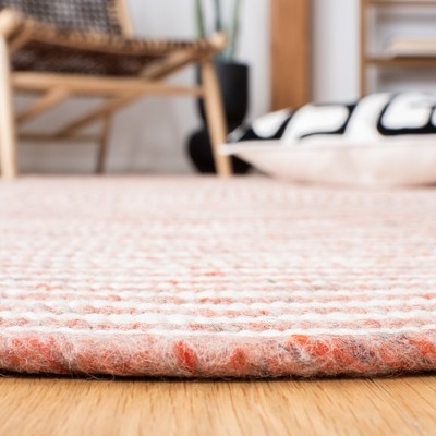 Red and Ivory Oval Braided Wool 4' x 6' Area Rug