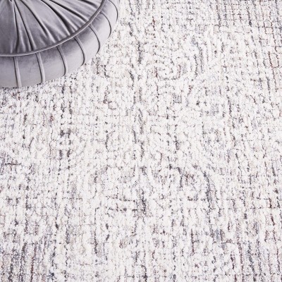 Ebony 6' x 9' Brown and Ivory Wool Tufted Area Rug
