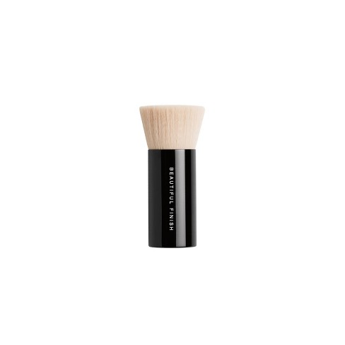 Buff on powder foundation with bareMinerals Handy Buki Brush.