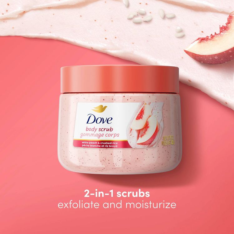 Dove Body Scrub with White Peach & Crushed Rice. The jar is peach-colored with a matching lid. Set against a soft pink background with peach slices and rice grains, highlighting its exfoliating and moisturizing benefits. 