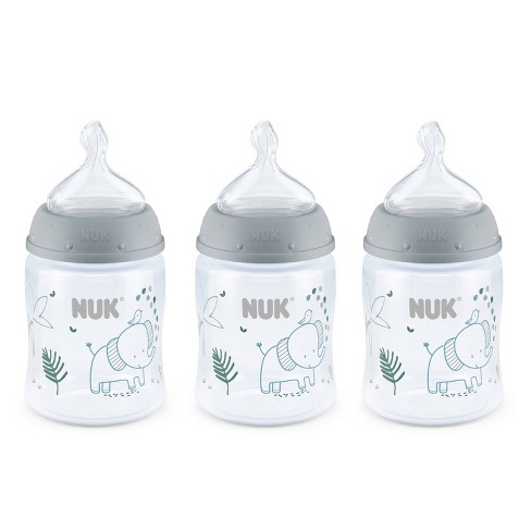 NUK Disney First Choice+ First Years Set, 0+ Months, Temperature Control, 2  x 300 ml Bottles, 1 x Learner Cup, 2 x Soothers, 2 Teats, Anti-colic Vent,  BPA-Free, Winnie-the-Pooh, 7 Count 