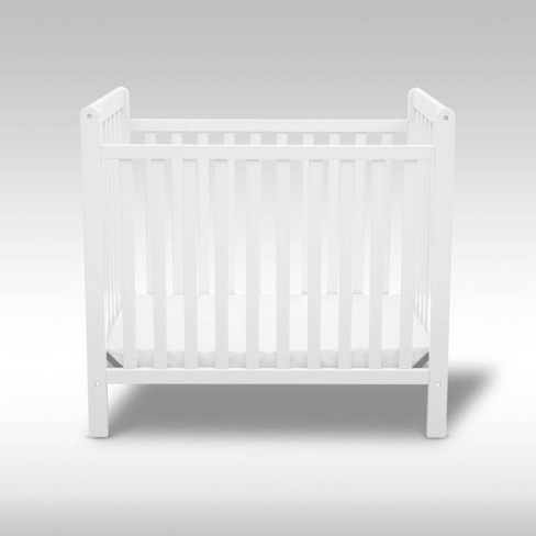 Mini crib toddler store bed