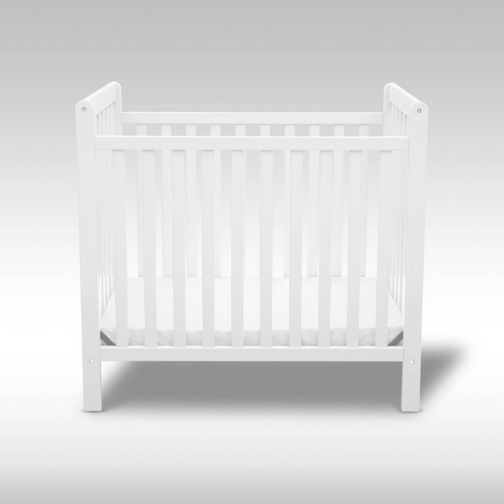 Delta Children Classic Mini Crib with 2.75'' Mattress - Convertible to Twin Bed, Greenguard - Bianca White