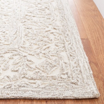 Ivory and Natural 4' x 6' Hand Tufted Wool Area Rug