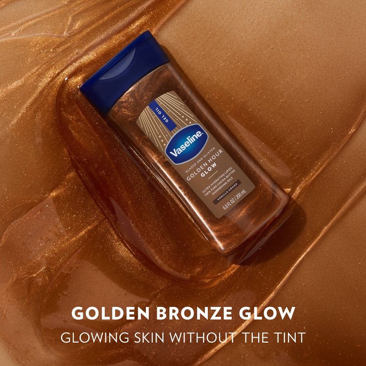 Vaseline Golden Hour Glow, 6.8 fl oz, set on shimmering bronze, offers glowing skin without tint. Blue cap, elegant design evokes luxury.