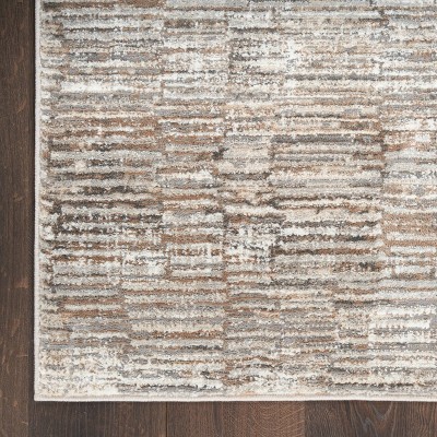 Ivory and Tan Abstract Synthetic Rectangular Rug 5' x 7'