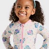 Toddler Girls' Disney Long Sleeve Minnie Mouse Sprinkle Printed One Piece Rash Guard - White - 3 of 3