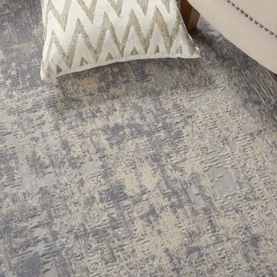 Ivory Abstract Power-Loomed Synthetic 5'3" x 7'3" Area Rug