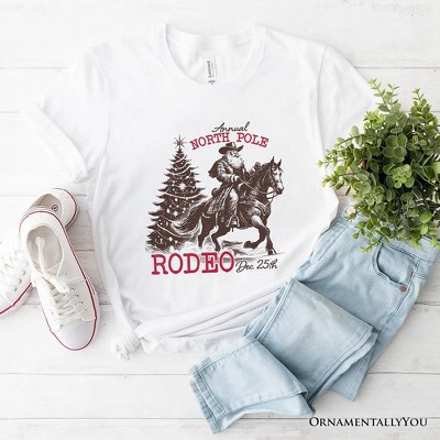 Annual North Pole Rodeo T-Shirt, Funny Cowboy Santa Christmas Tee for Country Lovers| OrnamentallyYou