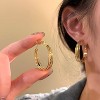 Women's Modern Gold Alloy Hoop Earrings, Stylish Multi-Layered Circular Design - 2 of 4