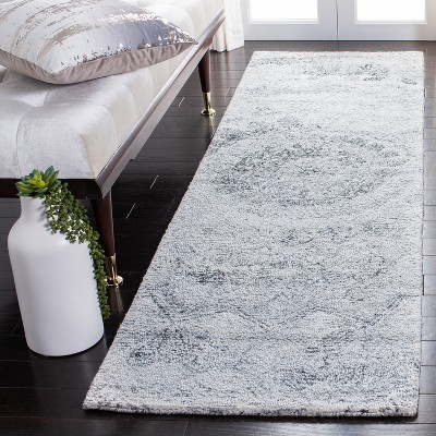 Elegant Abstract Black and Ivory Tufted Wool Rug - 27"x8"
