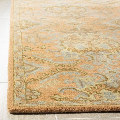 Handmade Light Blue and Terracotta Floral Wool Tufted Rug