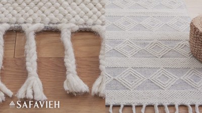 Ivory and Beige Handwoven Wool Area Rug with Fringe