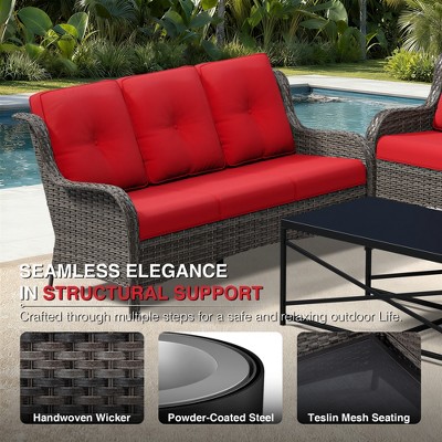 Close-up of outdoor sofa with red cushions