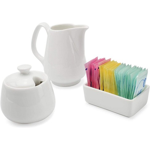 Ceramic sugar bowl and outlets pitcher