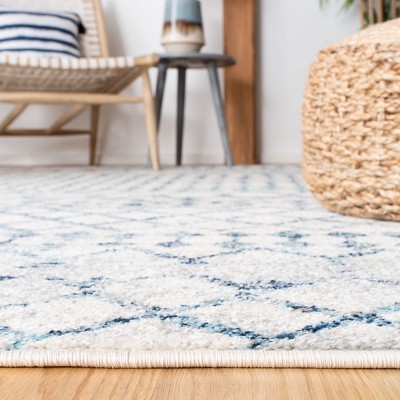 Ivory and Turquoise Geometric Synthetic Area Rug