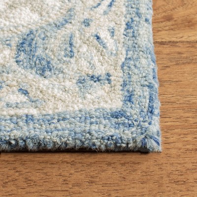 Handmade Blue and Ivory Wool 4' x 6' Tufted Area Rug