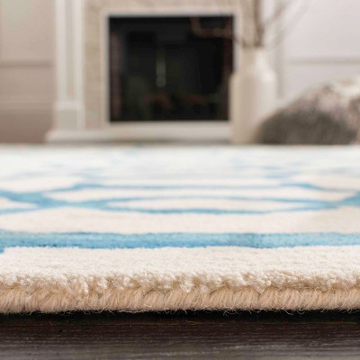 Ivory and Turquoise Hand-Tufted Wool 6' x 9' Area Rug