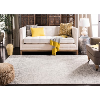 Ivory and Silver Geometric 8' x 10' Synthetic Area Rug