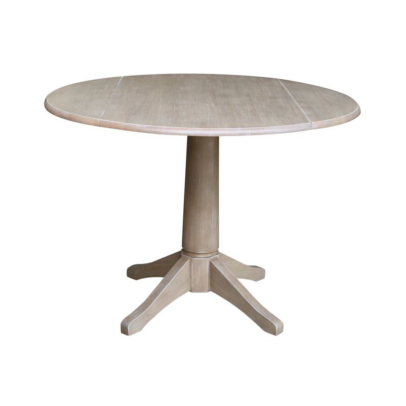 Alexandra Round Dual Drop Leaf Pedestal Table Washed Gray Taupe - International Concepts, 1 of 10