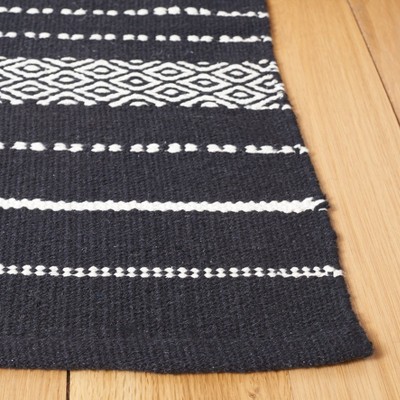 Handmade Black and Ivory Wool Flat Woven Rectangular Rug 4' x 6'