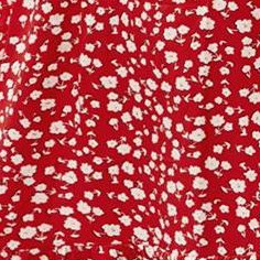 small white flower on red background