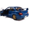2003 Subaru Impreza WRX STI RHD (Right Hand Drive) Sonic Blue Metallic with Gold Wheels 1/18 Diecast Model Car by Solido - 3 of 4