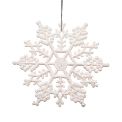 Christmas snowflakes glitter with sparkling light effect on white