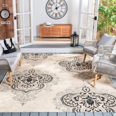 Cream and Black Damask 5' x 7' Synthetic Area Rug