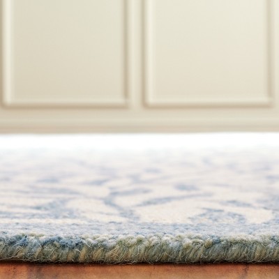Hand Tufted Ivory and Blue Floral Wool 4' x 6' Rug
