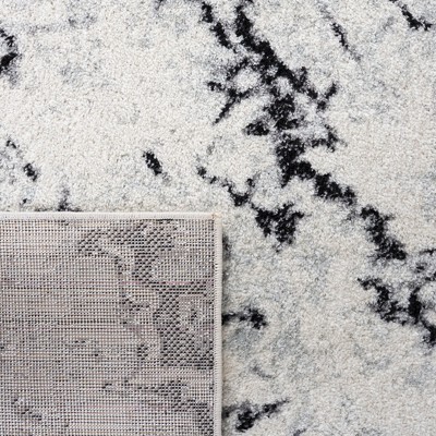 Ivory Boho-Chic Hand-Knotted Synthetic Area Rug