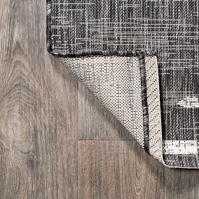 Zolak 4' x 6' Black and Ivory Synthetic Stripe Rug