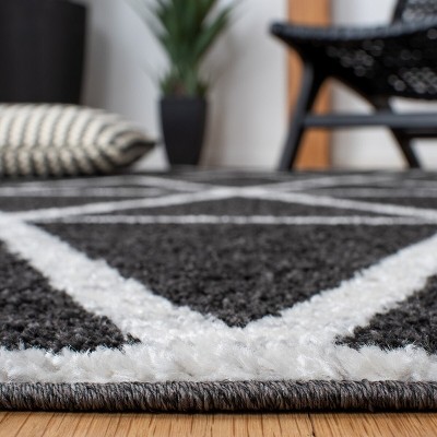 Black and Ivory Geometric Synthetic Area Rug