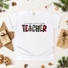 Simply Sage Market Very Merry Teacher Plaid Garment Dyed Tee - 3 of 4