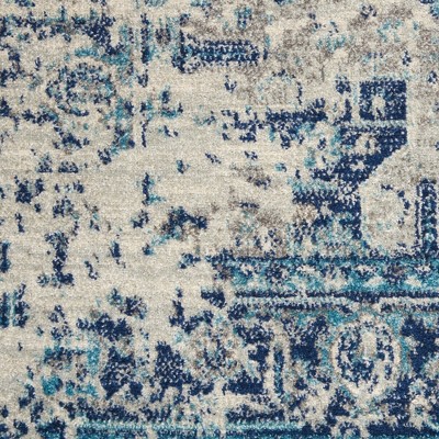 Ivory and Light Blue Synthetic 6' x 9' Easy Care Rug