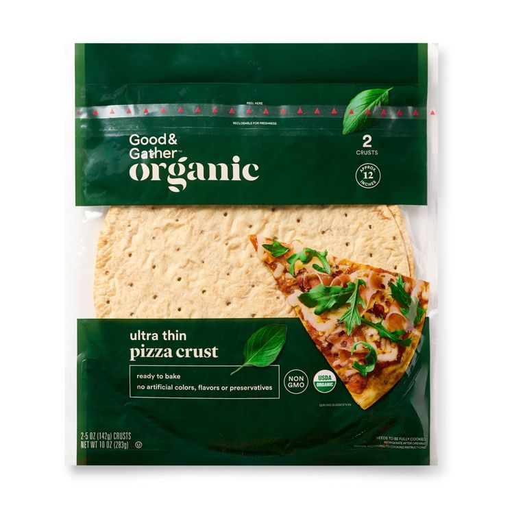 Package of Good & Gather organic ultra thin pizza crusts with a slice of pizza topped with greens and cheese shown on the front.