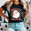 Simply Sage Market Women's Don't Stop Believin' Santa Checkered Short Sleeve Garment Dyed Tee - 2 of 4