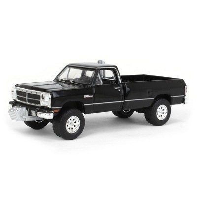 Greenlight Collectibles 1/64 1992 Dodge Ram 1st Generation Black Pulling Truck Outback Toys Exclusive 51386-A