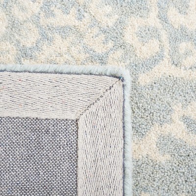 Ivory and Light Blue Tufted Wool Area Rug