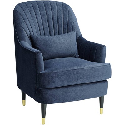 blue tufted armchair