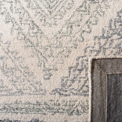 Off-White and Blue Round Tufted Wool Area Rug